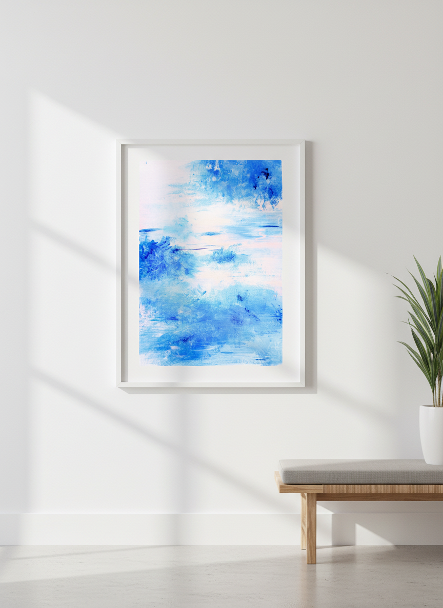 Abstract blue and white watercolor painting in white frame on a blank wall. 