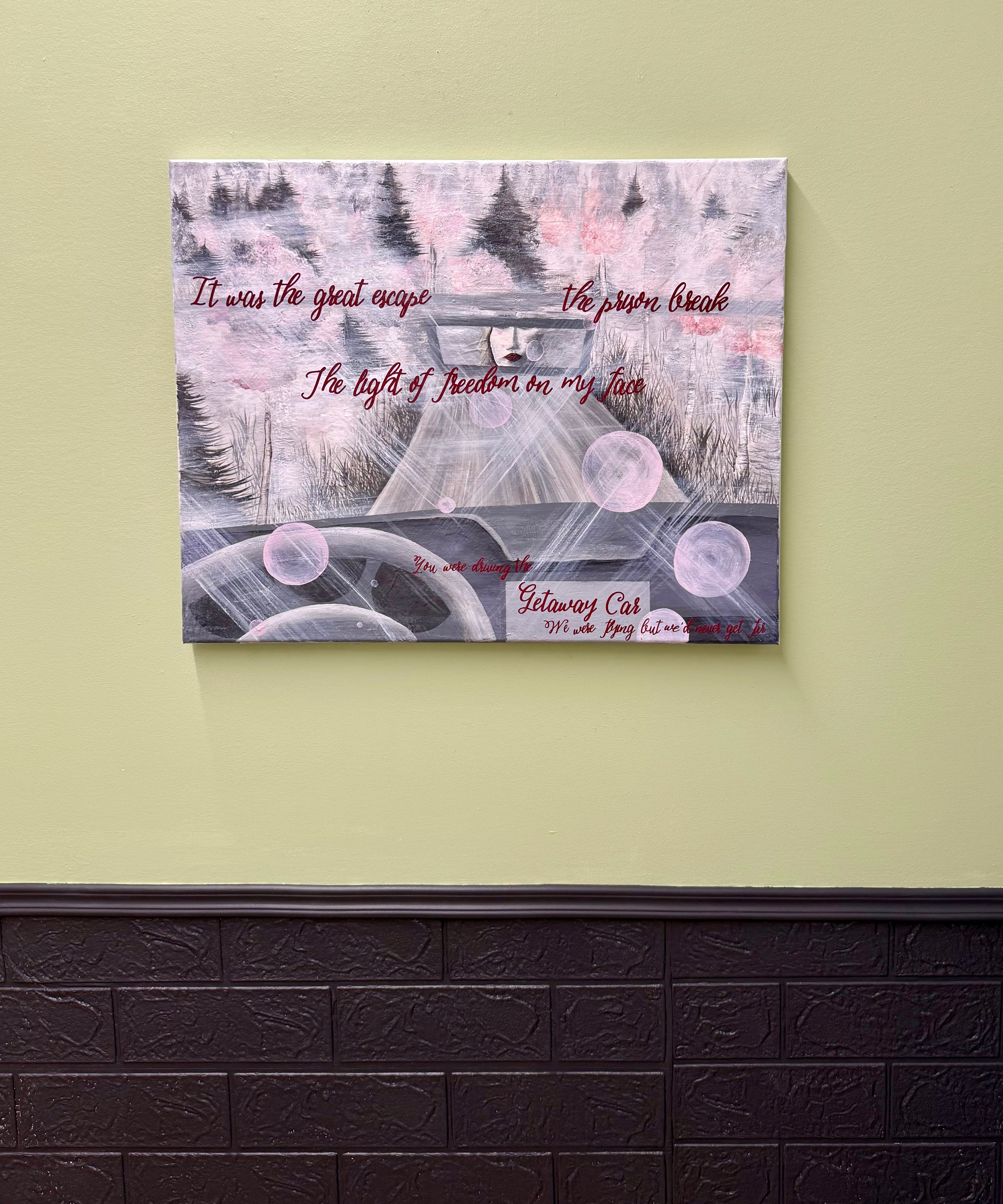 Canvas print with artistic design and text on a wall.
