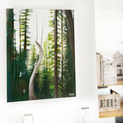 Forest painting on a white wall with a wooden shelf below