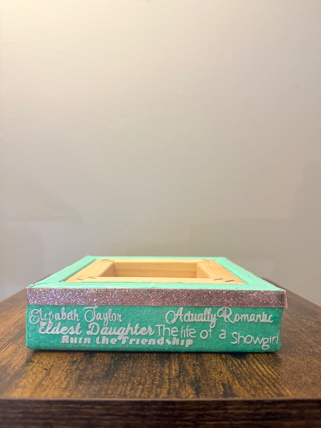Wooden box with text on a wooden surface